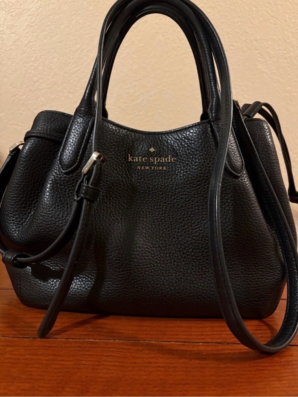 Kate Spade black pebbled leather satchel with gold logo